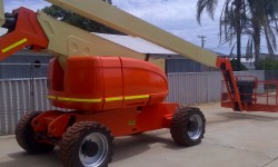 JLG 800AJ boom lift after repainted in orange and cream before decals are applied